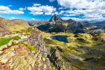 Lake Gentau and the famous Pyrenean peak Midi Ossau as seen from the mountain pass Ayous in Octber....