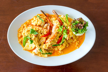 Stir fried shrimp or prawn in curry powder the famous delicious Thai food on white background
