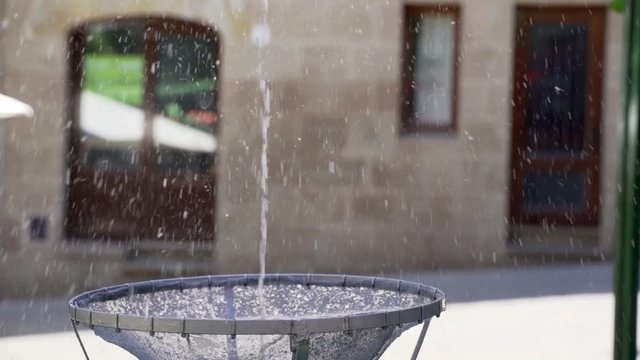 Close up view of the dancing egg placed over a water jet from a fountain. The dancing egg, or ou com balla in Catalan, is an old tradition that takes place in several towns in Catalonia during the