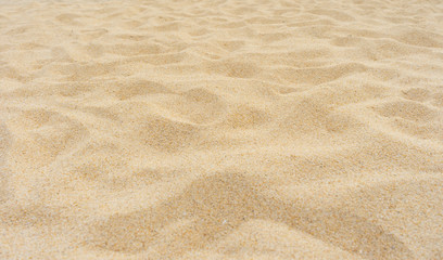 Fototapeta na wymiar Yellow beach sand texture as background.