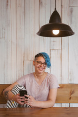 Lesbian woman using technology on a public place.