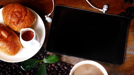 Empty space for entering text on the screen, touch screen communication devices and showing communication in the morning with coffee, milk and bread as food.