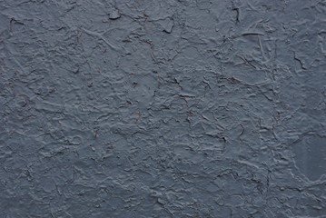 gray texture from old scuffed paint on a cracked wall