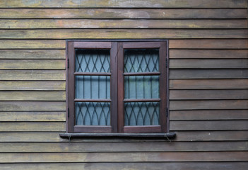 Wooden window on wood wall background. Texture vintage for interior.