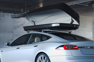 Luggage trunk box mountained on car roof rack. 3d rendering. © ekostsov