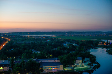 Beautiful view of coastal city Anapa with river flowing into the sea on the sunset.