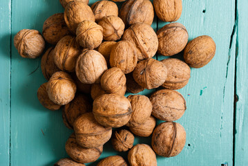 walnuts on blue wooden table background