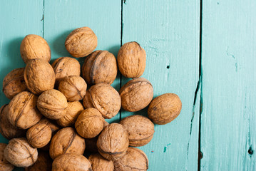 walnuts on blue wooden table background