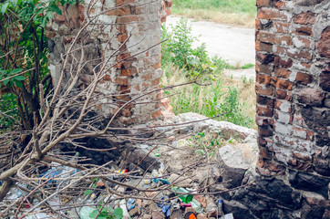 Garbage dump in the old destroyed building, environmental protection
