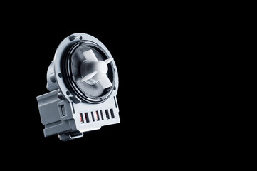 Naklejka premium New engine plastic pump for washing machine on a black background, isolate