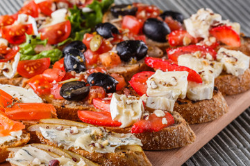 Assorted bruschetta Set of various appetizing snacks sandwiches