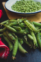Open organic green peas in a pile