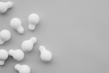 Ideas inspiration concepts with group of lightbulb on gray background.