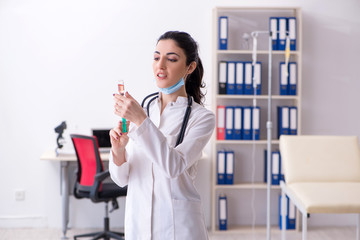 Young female doctor in infusion concept 
