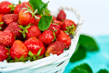 Strawberries in white basket. Fresh strawberries. Beautiful strawberries.