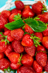 Strawberries in white basket. Fresh strawberries. Beautiful strawberries.