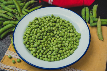 Organic green pea in a tin plate