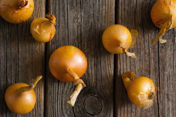 onions on weathered wooden table background