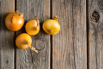 onions on weathered wooden table background