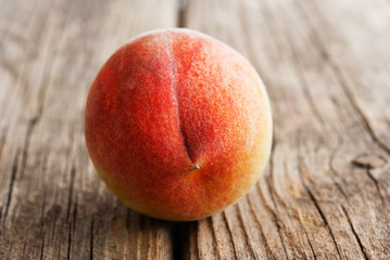 peach fruit on old weathered wooden table background