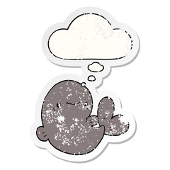 cartoon whale and thought bubble as a distressed worn sticker