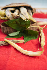 Organic yellow beans on a red kitchen cloth