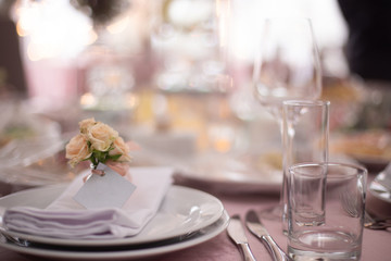 Wedding decorated table. Luxury light decor on table in restaurant