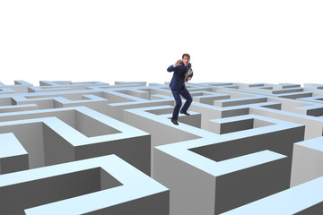 Businessman trying to escape from maze 