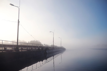 Fog in the lake. Morning nature water white fog.