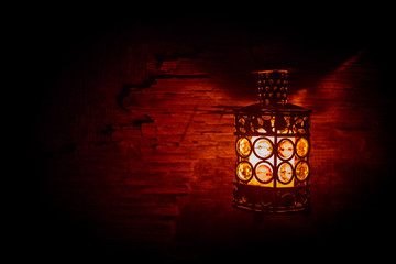 Fototapeta na wymiar Arabic lantern with candle at night for Islamic holiday. Muslim holy month Ramadan. The end of Eid and Happy New Year.