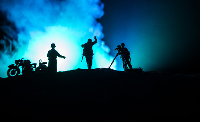 Obraz na płótnie Canvas War Concept. Military silhouettes fighting scene on war fog sky background,