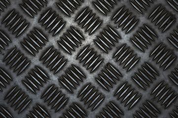 Metal floor with corrugated surface close-up. Corrugated aluminum sheet, background texture.
