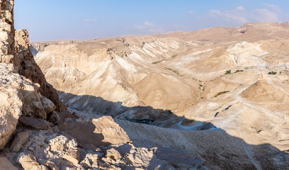 Morning view from the destroyed Masada fortress to the Roman mound for an assault from the south side of the fortress in the Judean desert in Israel