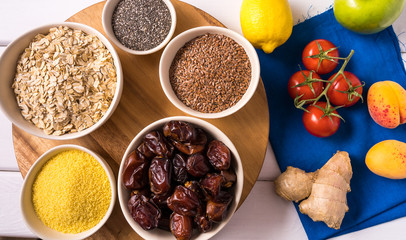 Superfoods in Bowls , fresh vegetables over white wooden Background.