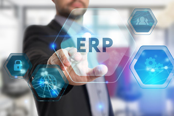 The concept of business, technology, the Internet and the network. A young entrepreneur working on a virtual screen of the future and sees the inscription: ERP