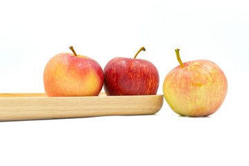 red apple on a plate isolated on white
