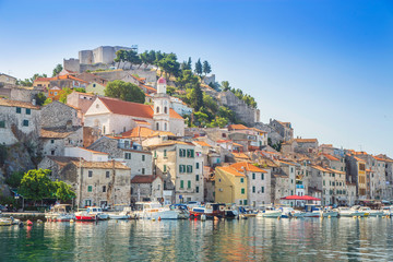 Fototapeta na wymiar The old town of Sibenik on the Adriatic coast in Dalmatia, Croatia, famous tourist destination, boats in harbour