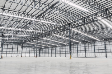 Empty warehouse. Factory building or warehouse building with concrete floor for industry.