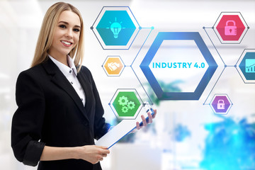 The concept of business, technology, the Internet and the network. A young entrepreneur working on a virtual screen of the future and sees the inscription: Industry 4.0
