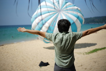man ready  for parachuter on the beach