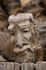 Fototapeta na wymiar Bamboo Wood carving human faces in Ontario, Canada