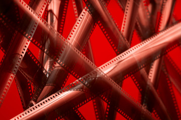 Analog film tape. Selective focus. Red color theme.