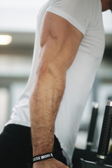 Close up view of man's hand until work out in the gym