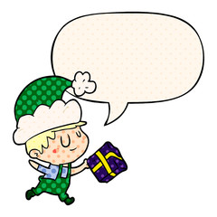 cartoon happy christmas elf and present and speech bubble in comic book style