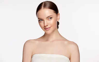 Beautiful Young Woman with Clean Fresh Skin . Facial  treatment   . Cosmetology , beauty  and spa . Nice and attractive girl with a pleasant smile.