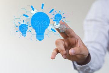  holding illuminated light bulb, idea, innovation and inspiration concept.