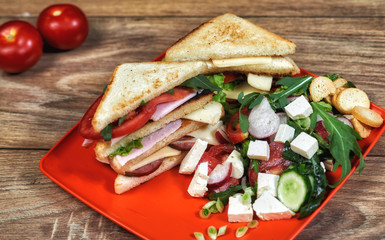 Light summer quick Breakfast , ham sandwich and fresh salad .