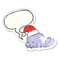 cartoon christmas walrus and speech bubble distressed sticker
