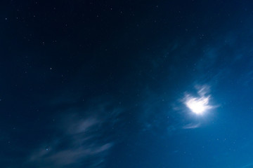Obraz na płótnie Canvas night sky. moon and stars. long exposure