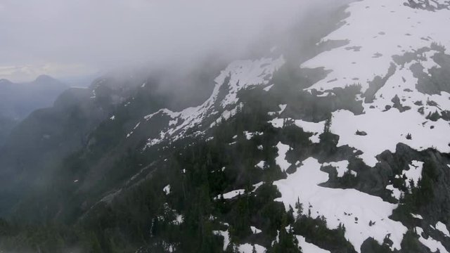 Aerial view of Misty, Snowy Mountainside in Vancouver, Canada
